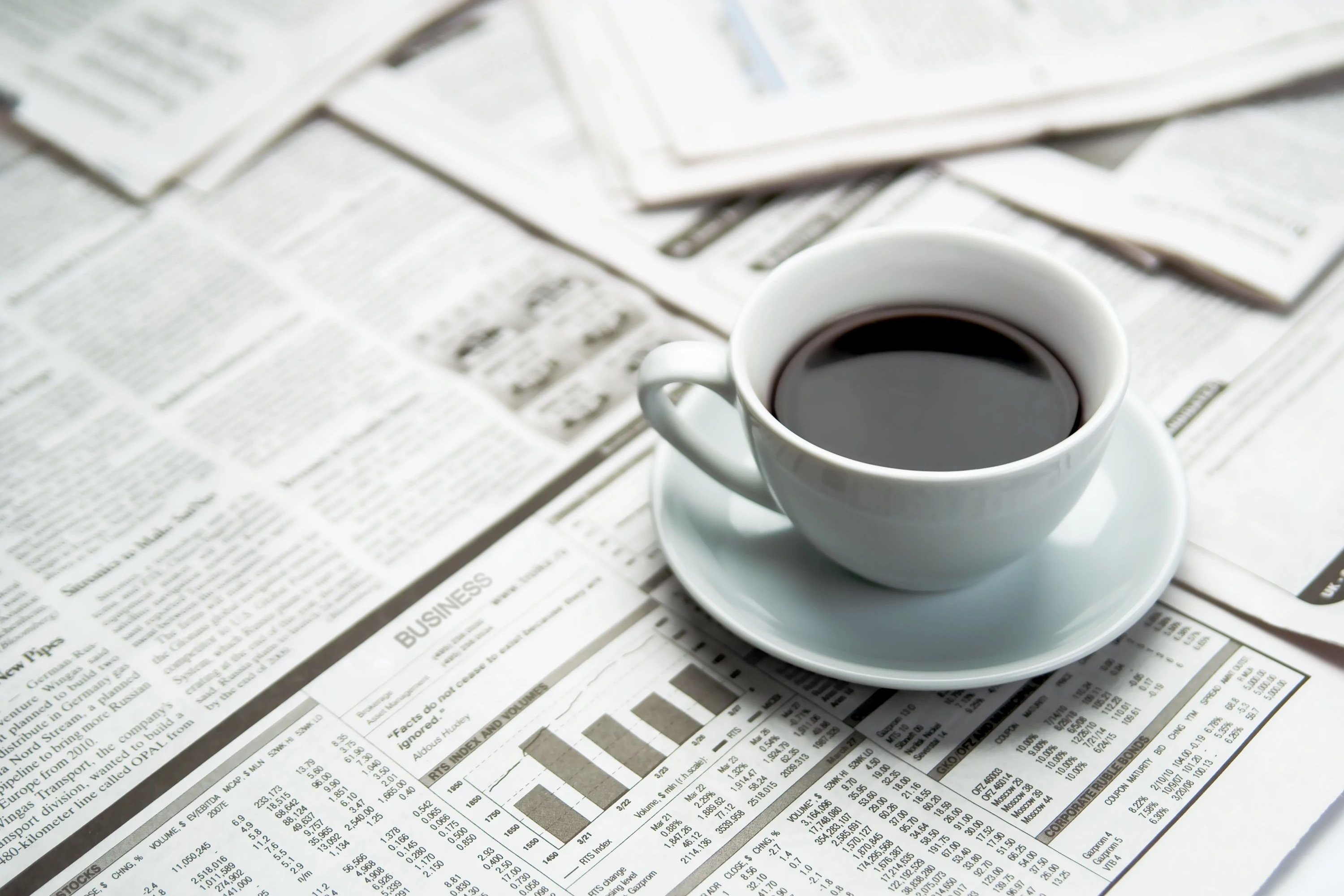 coffee cup on newspaper